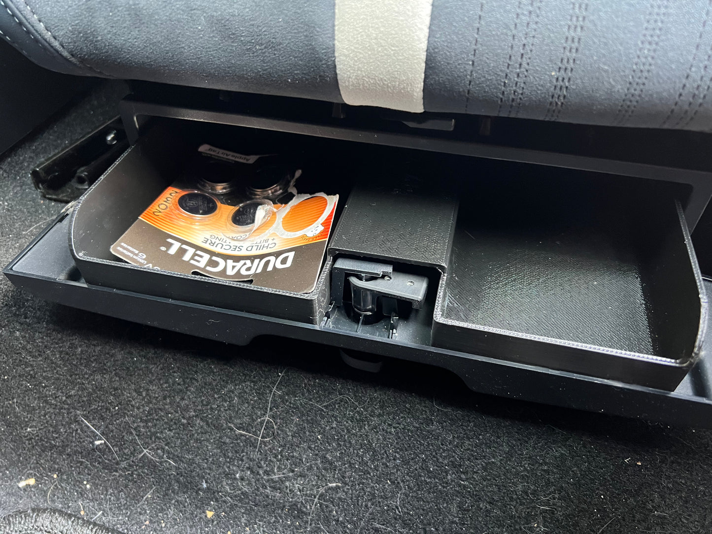 Under-seat storage drawer for FISKER Ocean