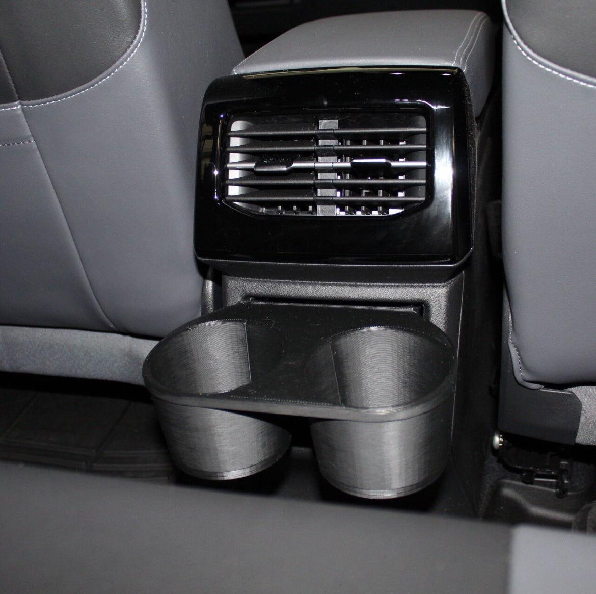 Rear two-cup cup holder for 2023 Volkswagen VW ID.4. This is must have accessory for base version of the ID.4 that does not have a cupholder in the rear seat. Must have Id.4 mod.